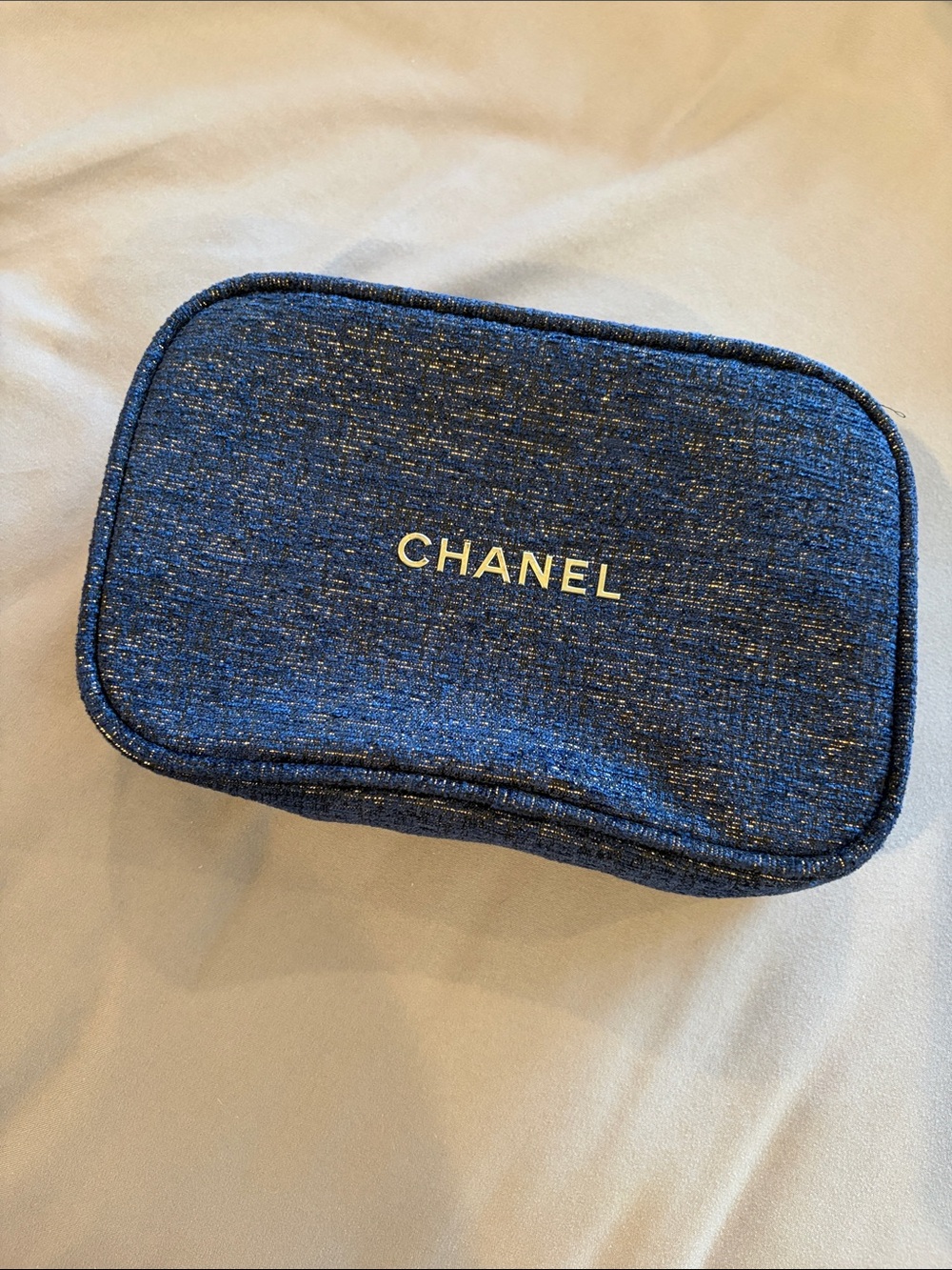 Brand new CHANEL Blue Tweed Zip Pouch with Gold Logo